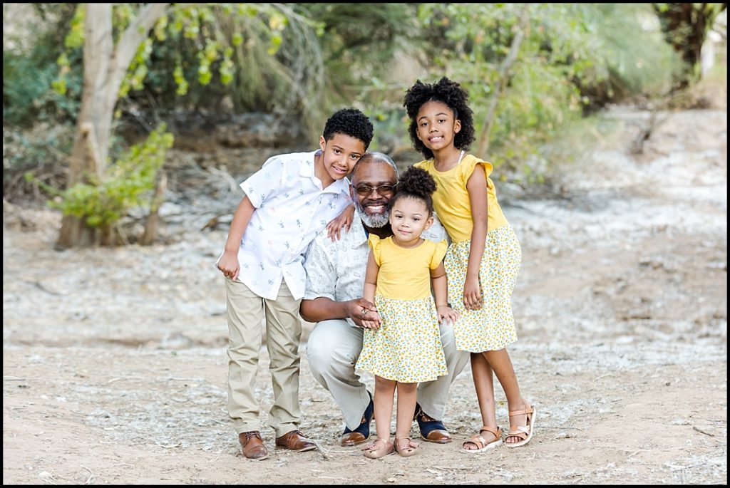 A picture of a dad and his 3 kids at the Queen Creek Wash for a Mommy and Me Mini Session